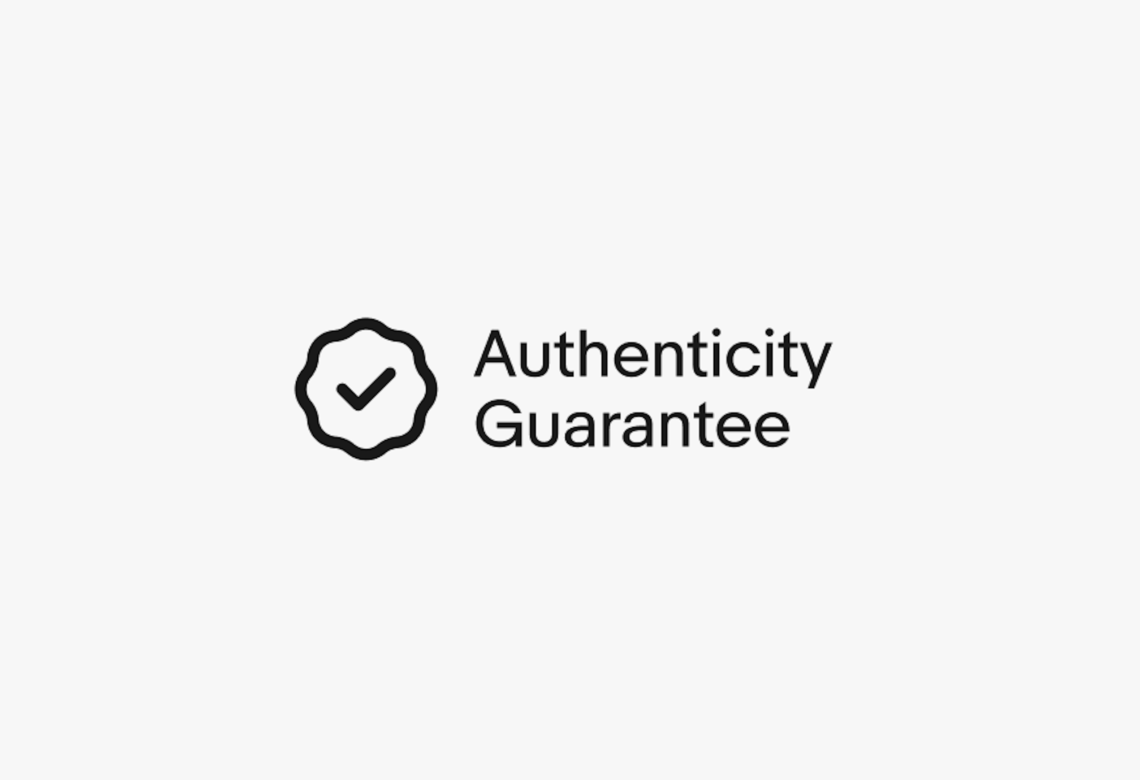 A rosette checkmark icon next to a double line of text. “Authenticity” is on the first line and “Guarantee” on the second.