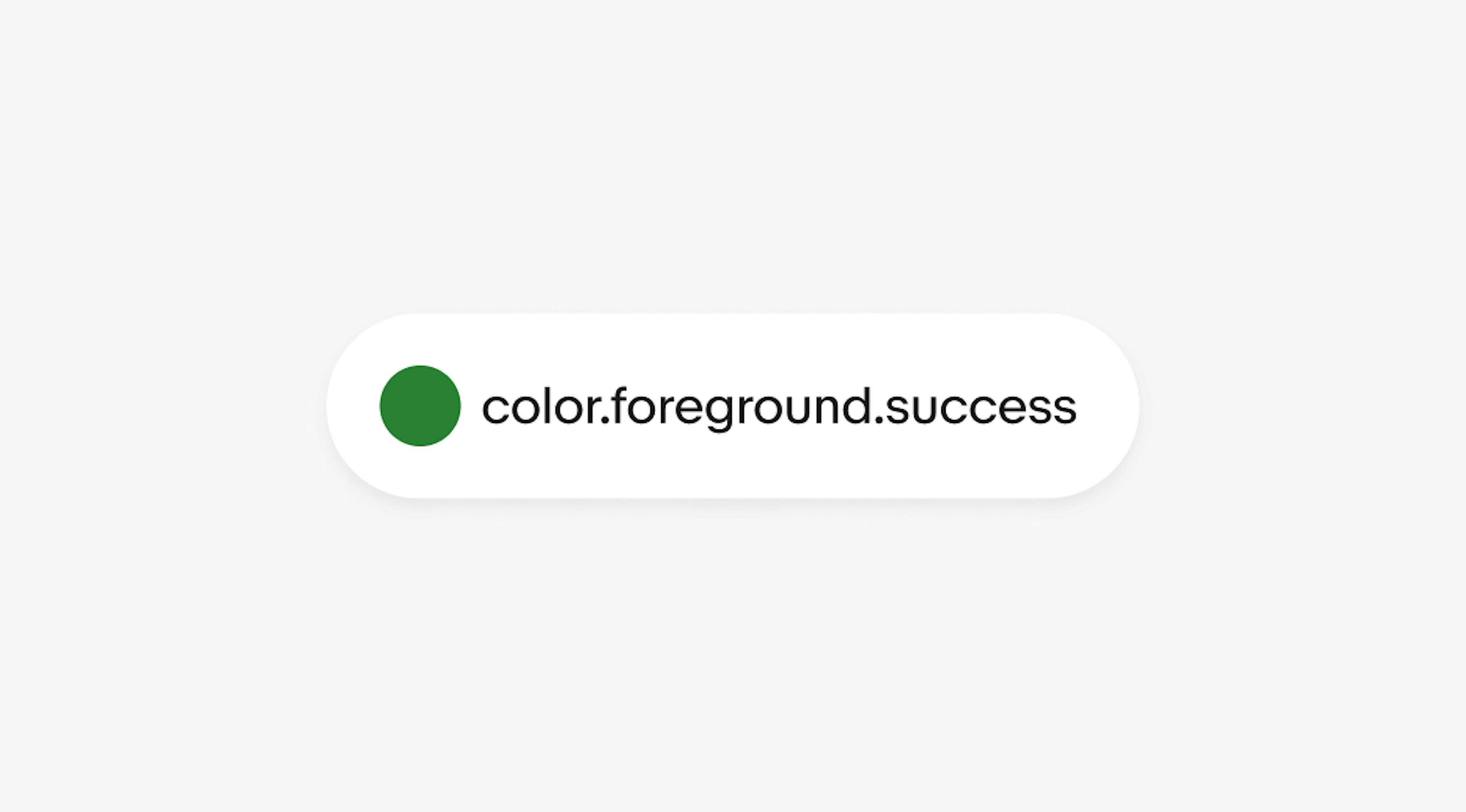 A pill graphic containing a circle in green with the text “color.foreground.success”.