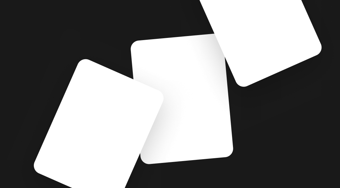Three white cards stacked organically. The bottom left and upper right are both overlapping the middle card. They both have shadows applied to show depth.