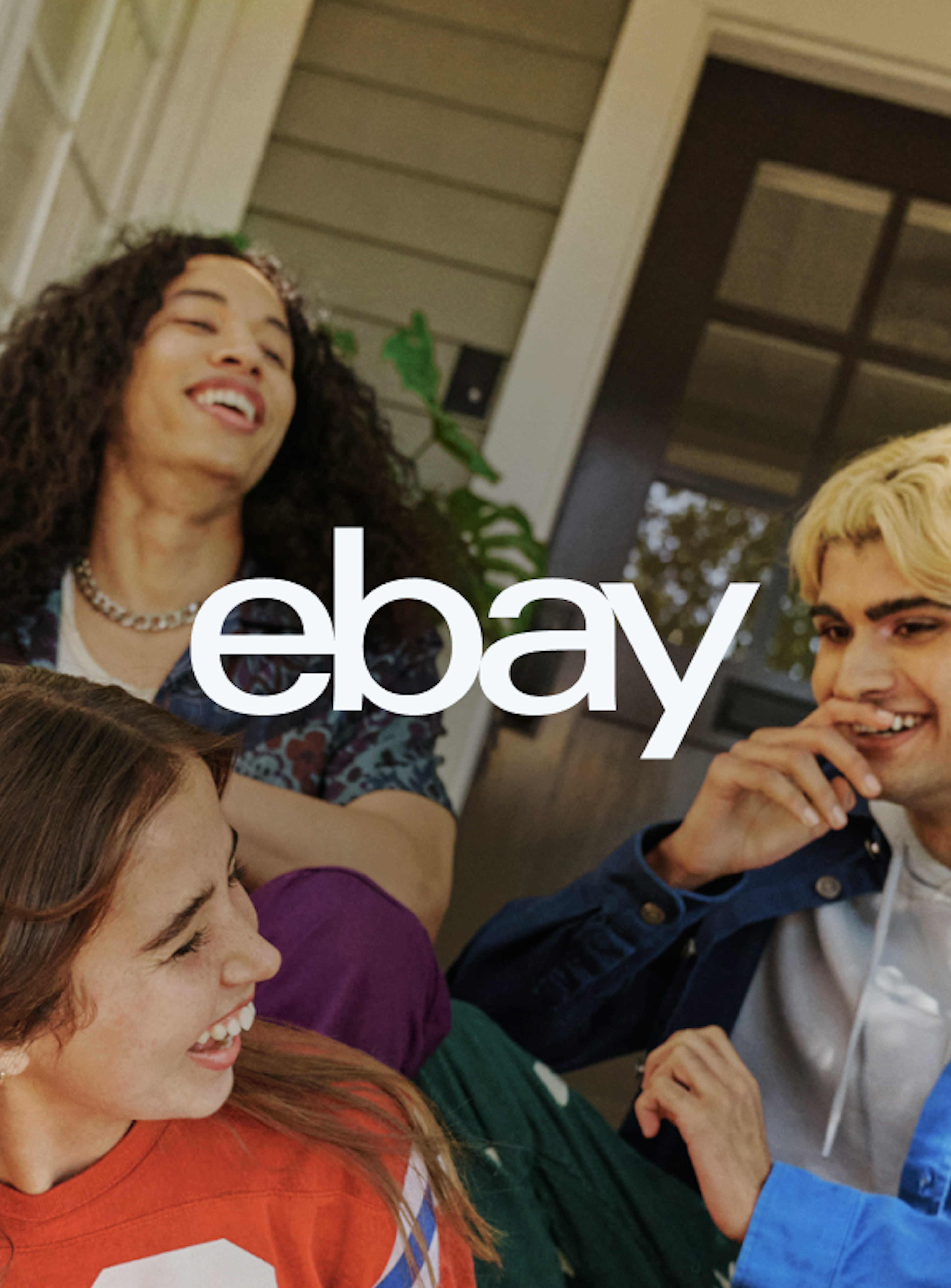 A white eBay logo, on top of an image of three people.