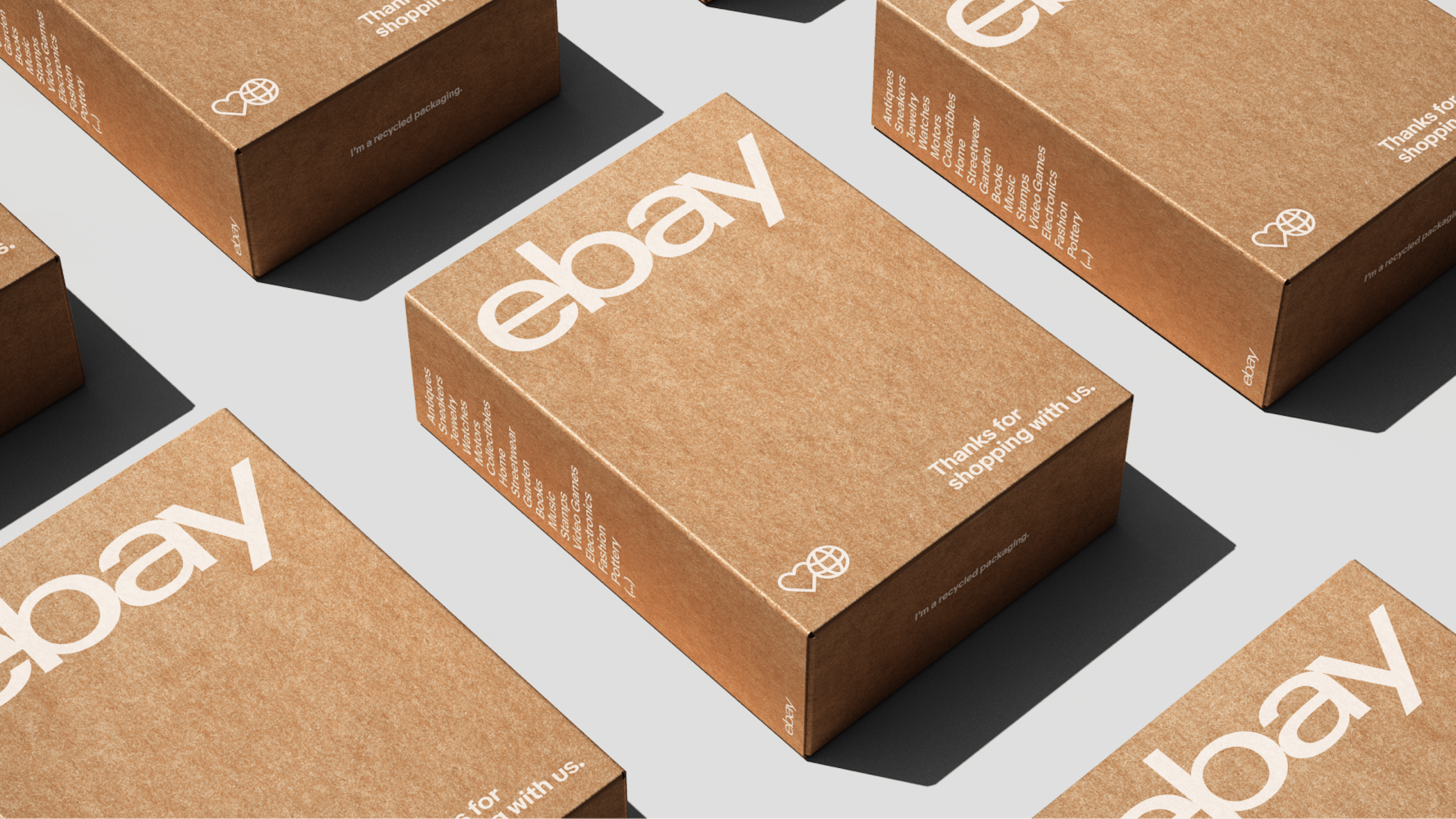 eBay packaging: square cardboard boxes in a grid with white text and logo.