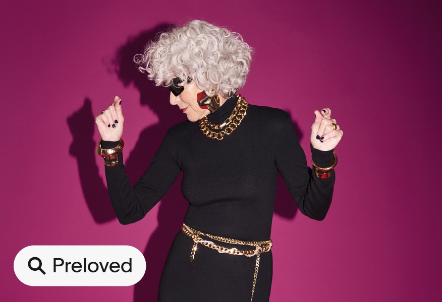 a ‘Preloved’ filled UI Element with a search icon sits on the bottom left corner of an image of a person wearing a black dress and gold accessories dancing against a pink backdrop.