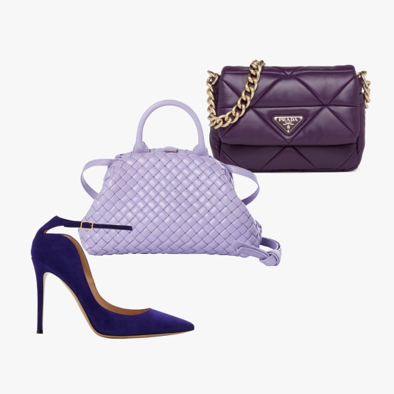 A purple high-heeled shoe, a lavender woven handbag, and a dark purple Prada handbag with a gold chain strap, displayed together arranged in an organized way.