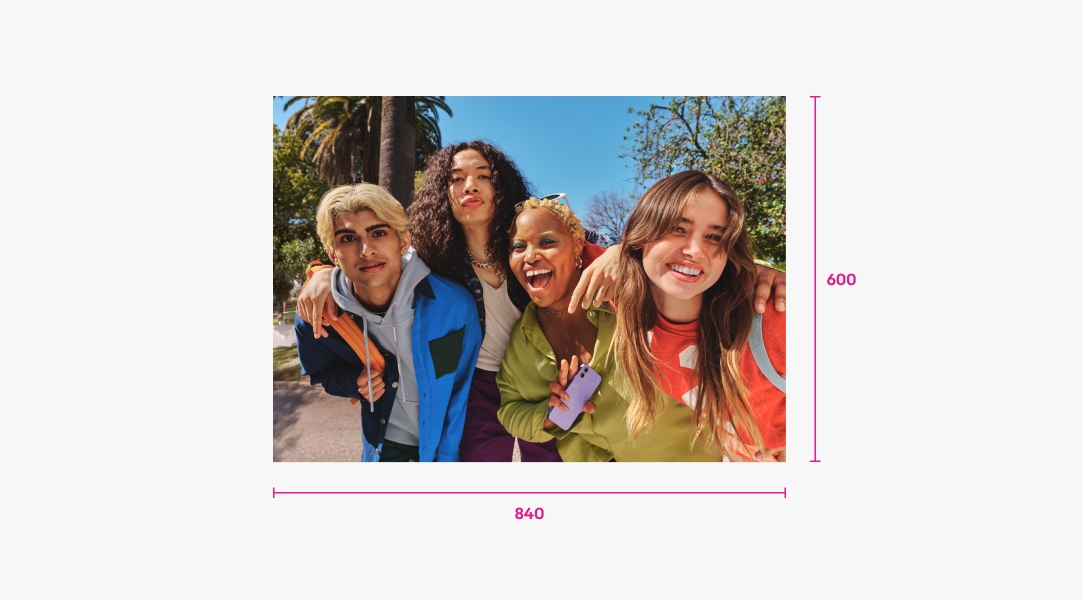 Rectangular photo of 4 friends outside with a palm tree behind them. There are two measurements. The measurement on the right shows the height is 600px and extends top to bottom. The measurement on the bottom shows the width is 840px from left to right.