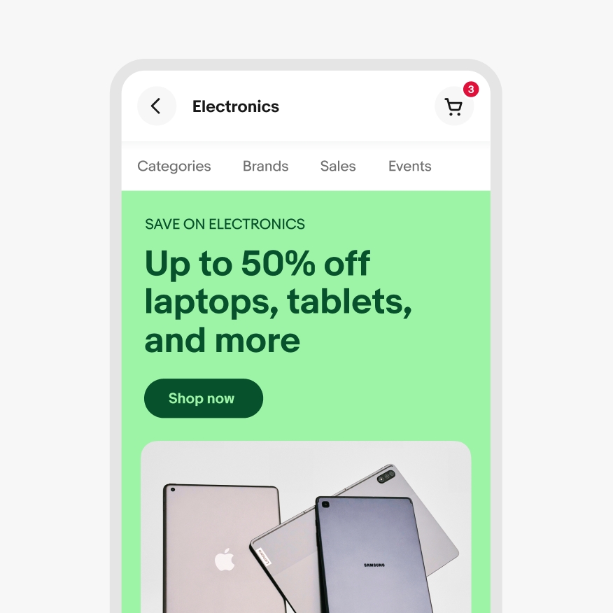A closeup of the eBay app in light mode, with a light green banner with dark green text displaying various electronic tablets.