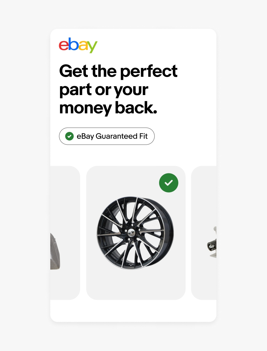 An out-of-home eBay ad with a filled eBay Guaranteed Fit program badge lockup inside of a pill shape. A filled icon is also placed on top of an image of a tire rim.