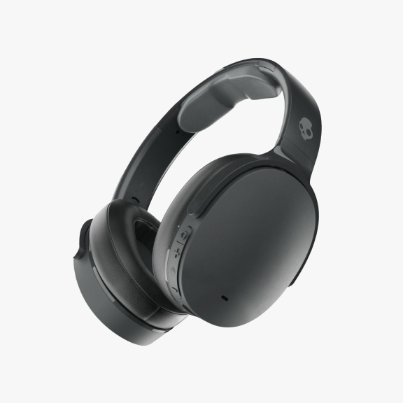 A pair of black Skullcandy over-ear headphones with a sleek design is shown. The headphones feature the Skullcandy logo on the ear cup and have buttons for controls on the side.