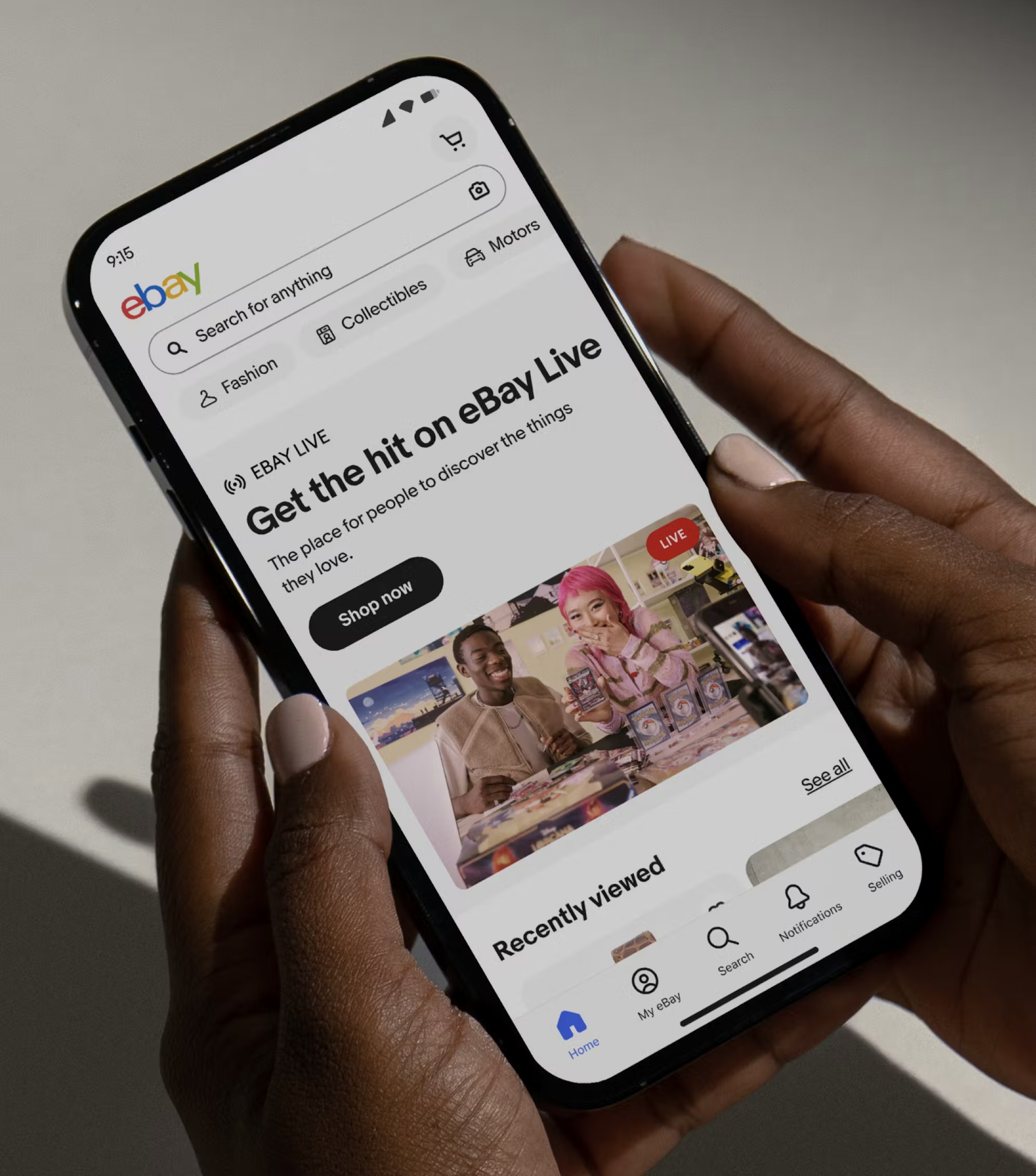 A mobile screen of the eBay homepage with a banner ad for eBay live.