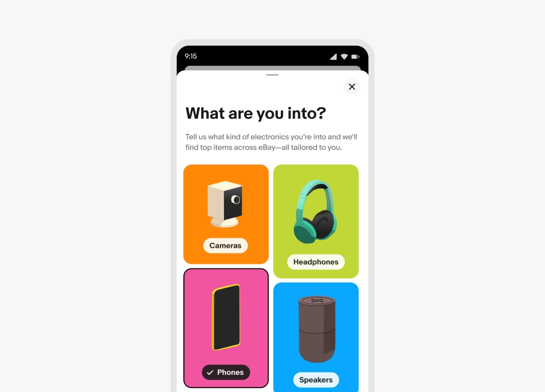 A full screen modal on mobile that says, “What are you into?” at the top with masonry grid of illustrations on colored backgrounds below that are category selectors. Categories are “Cameras, headphones, phones and speakers”. Each have their own illustration specific to the category.