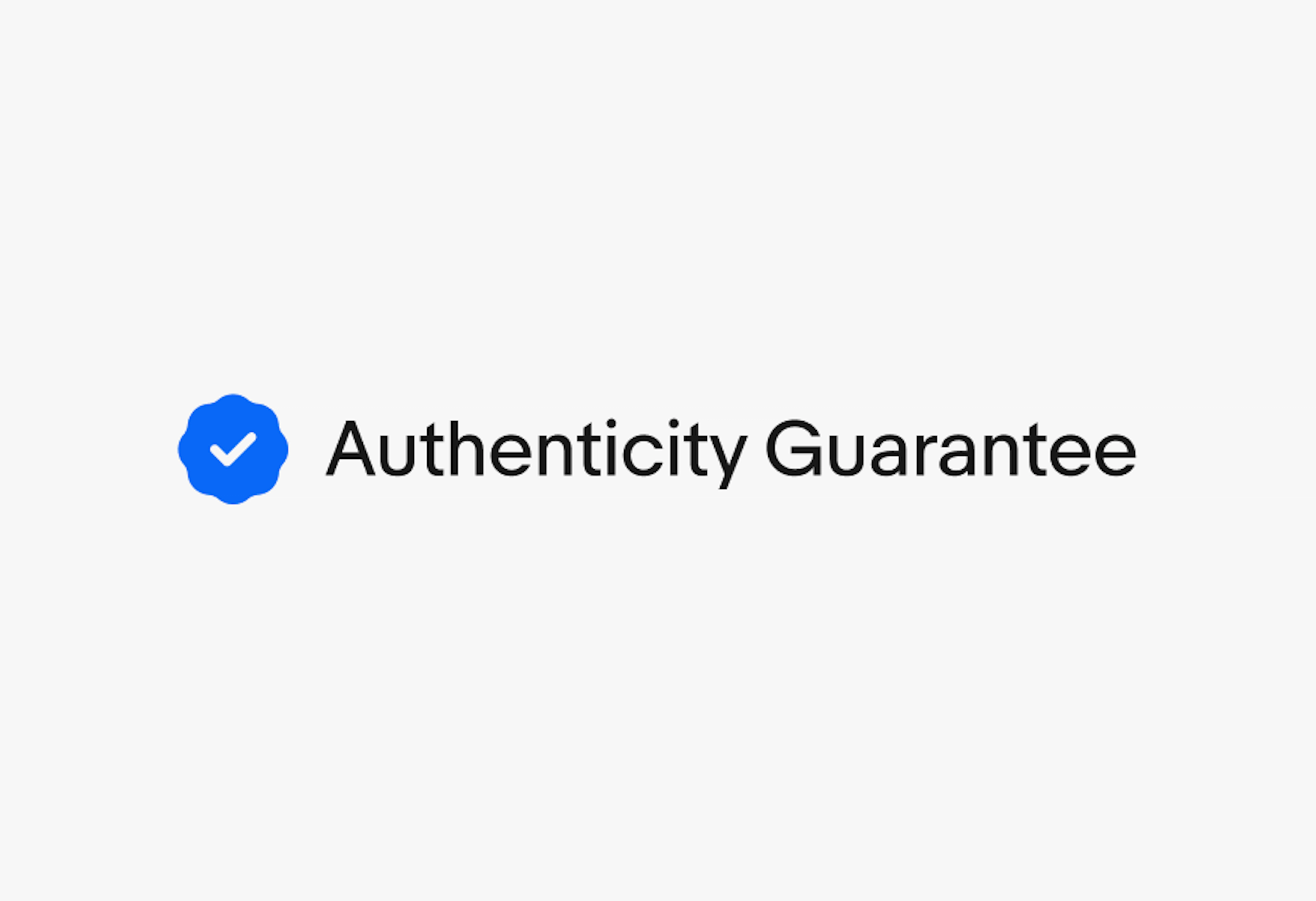 A rosette checkmark icon next to a single line of text “Authenticity Guarantee”.