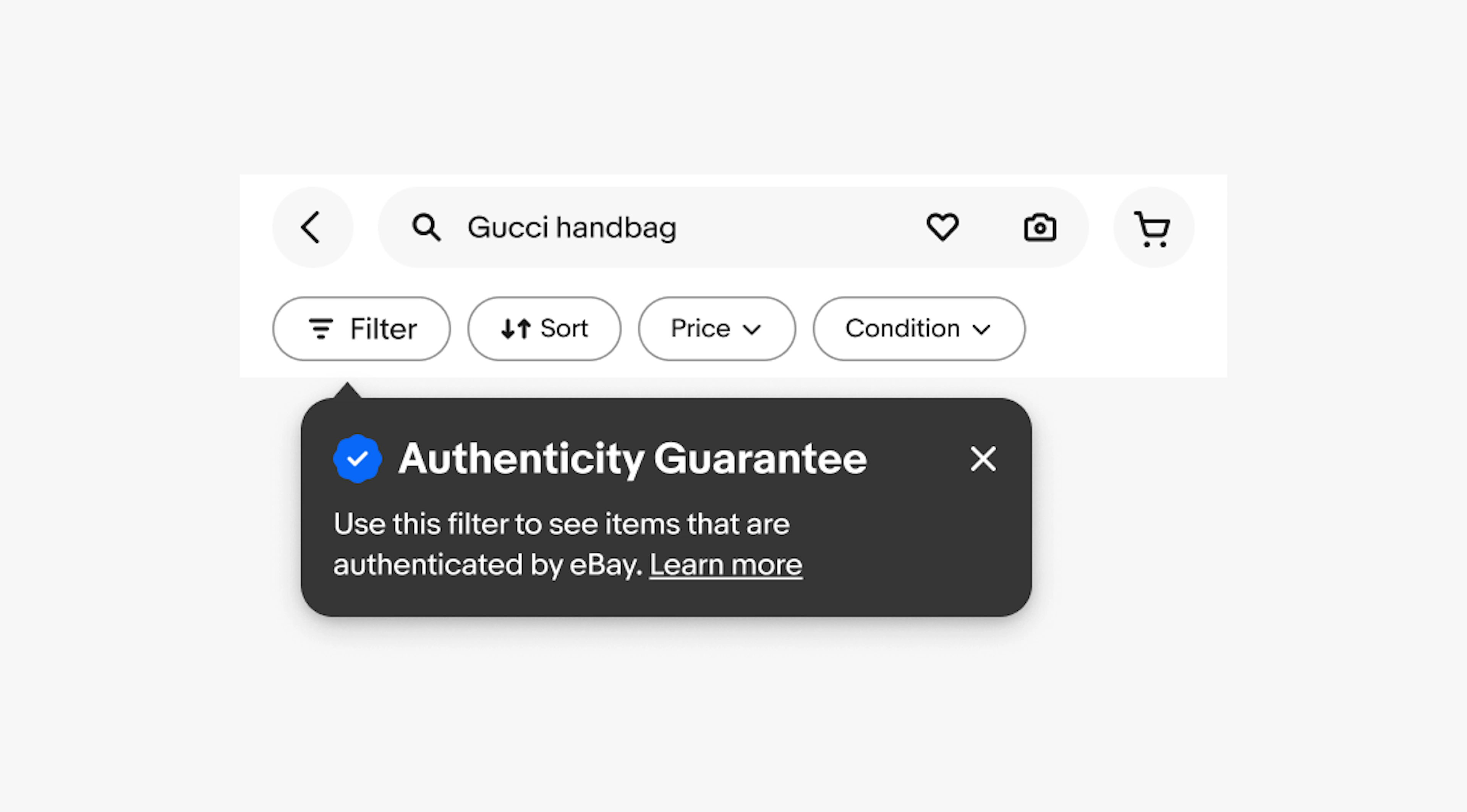 A single-step tourtip under a filter button with the Authenticity Guarantee icon and a title of “Authenticity Guarantee” and a subhead of “Use this filter to see items that are authenticated by eBay. Learn more”.