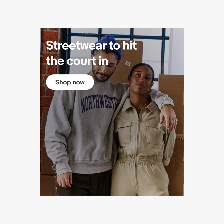 Full bleed image background banner with with text layered on top in the top left corner. The photo is of two business owners standing in their warehouse. The text in the top left corner is covering the man on the left’s head, face and shoulders.