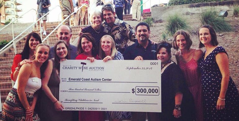 Members of ECAC holding a donation