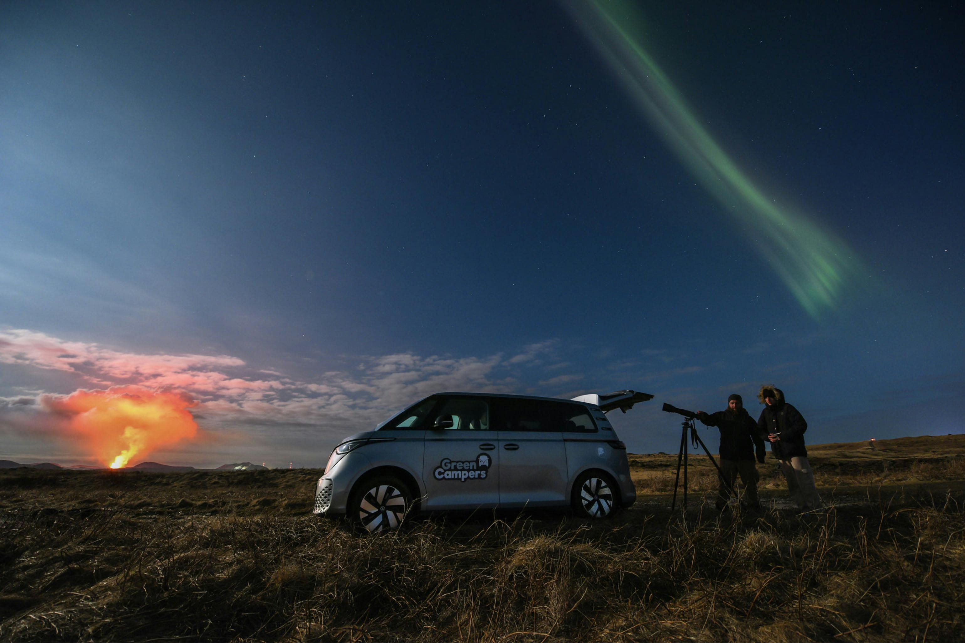 Electric car under Northern Lights and volcanic eruption. Credit: Gísli Már Árnason