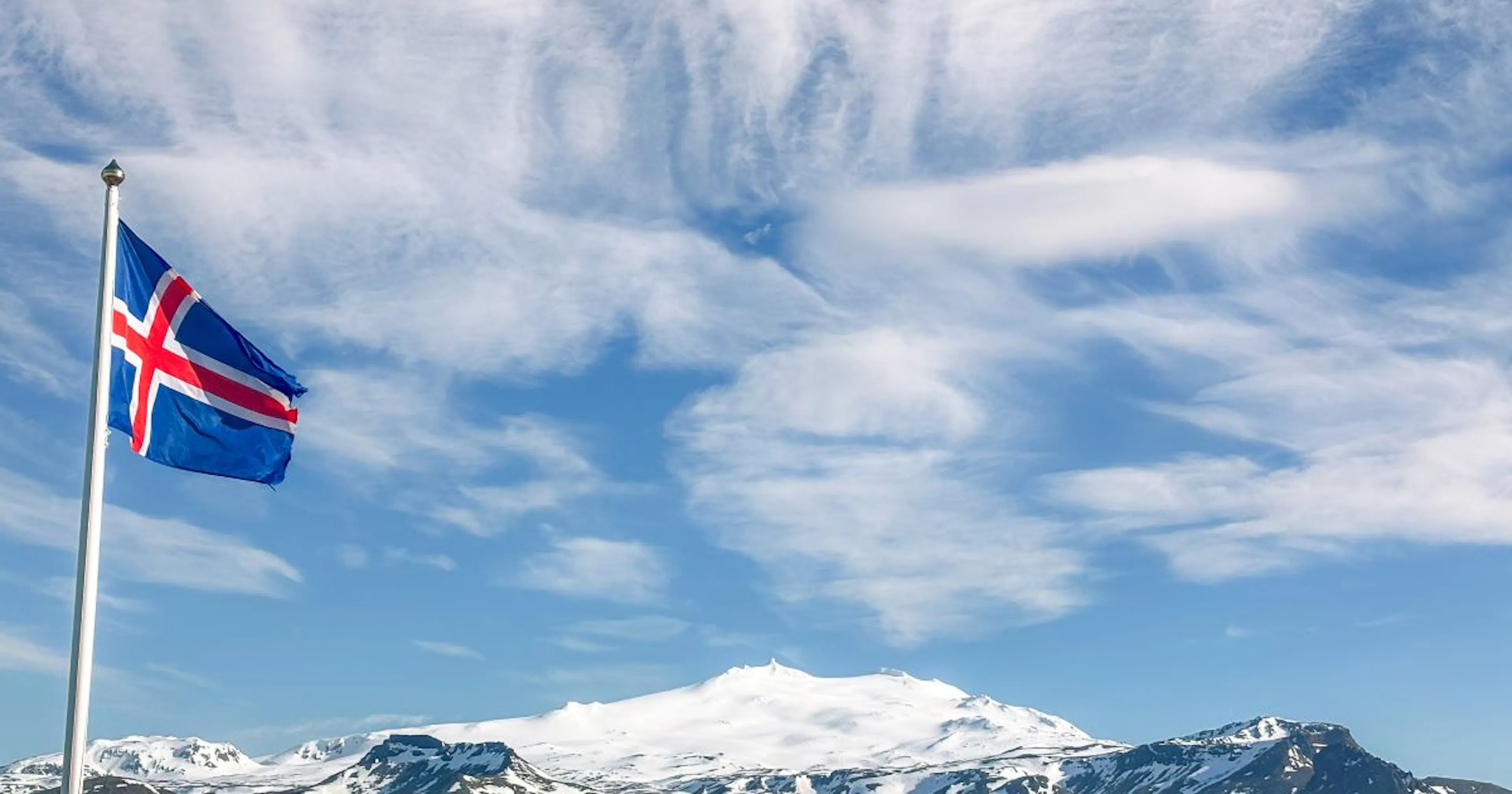 Icelandic flag and Snæfellsjökull glacier. Credit: Visit West