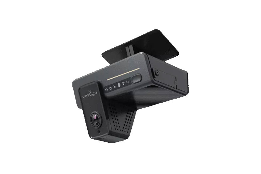 In-vehicle dash camera device mounted on a bracket, showing a forward-facing lens and control buttons.