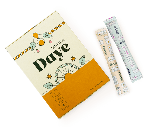 A cream and orange Daye Sampler box with 2 tampons Nude and coated to the side