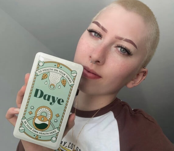 Girl showing her Daye's organic CBD tampon gift box
