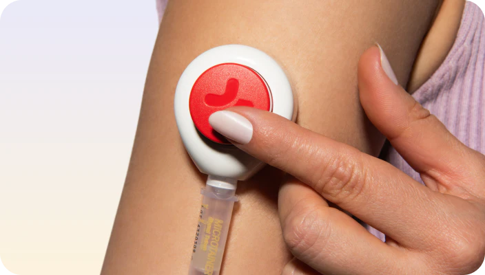 A needle-free hormone test device held against an arm
