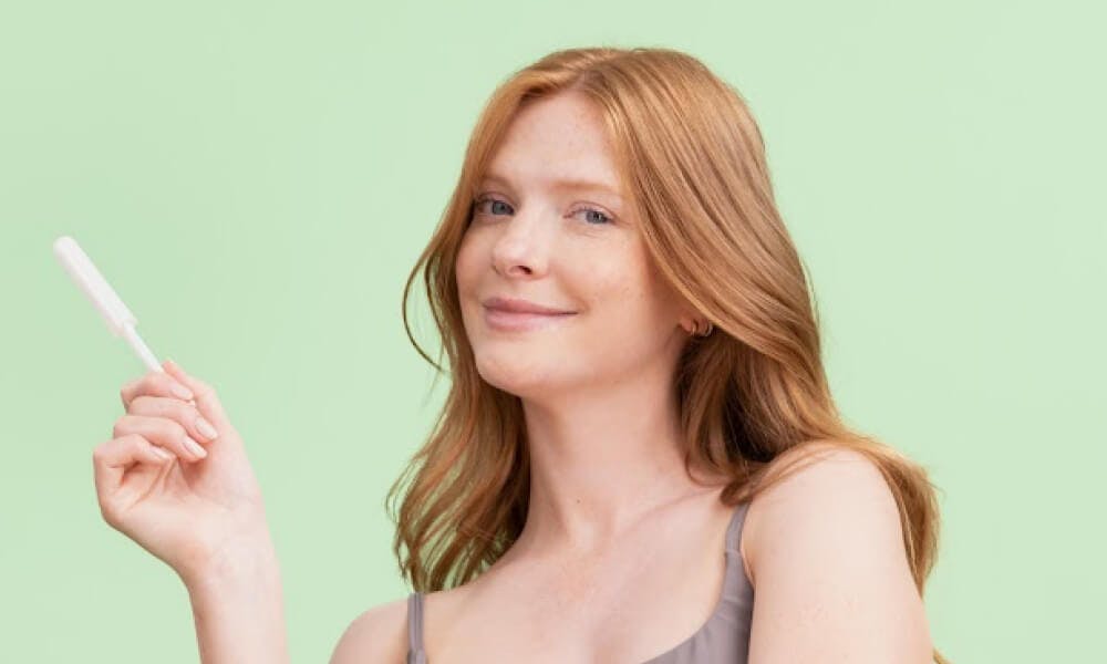 Woman holding a diagnostic tampon