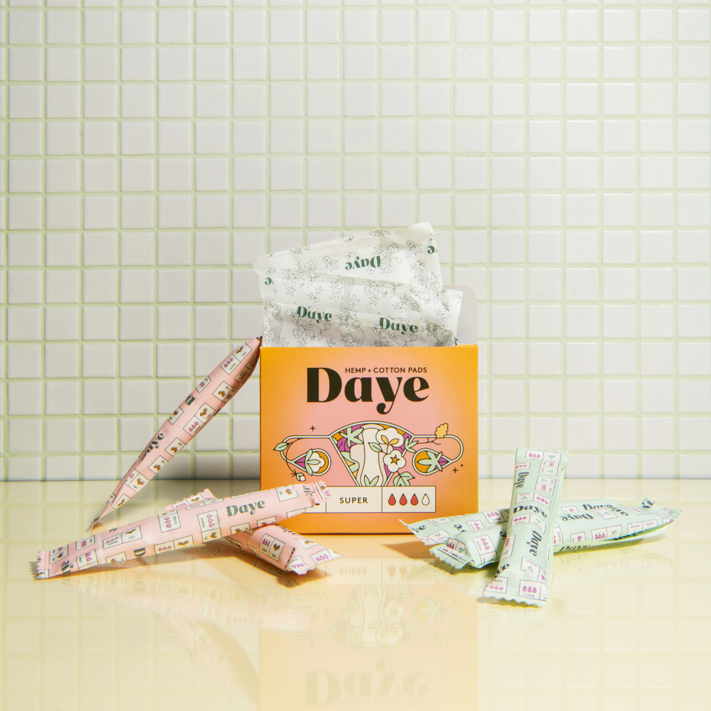 Organic, eco-friendly, sustainably packaged tampons from cotton and pads from hemp & cotton are standing next to each 