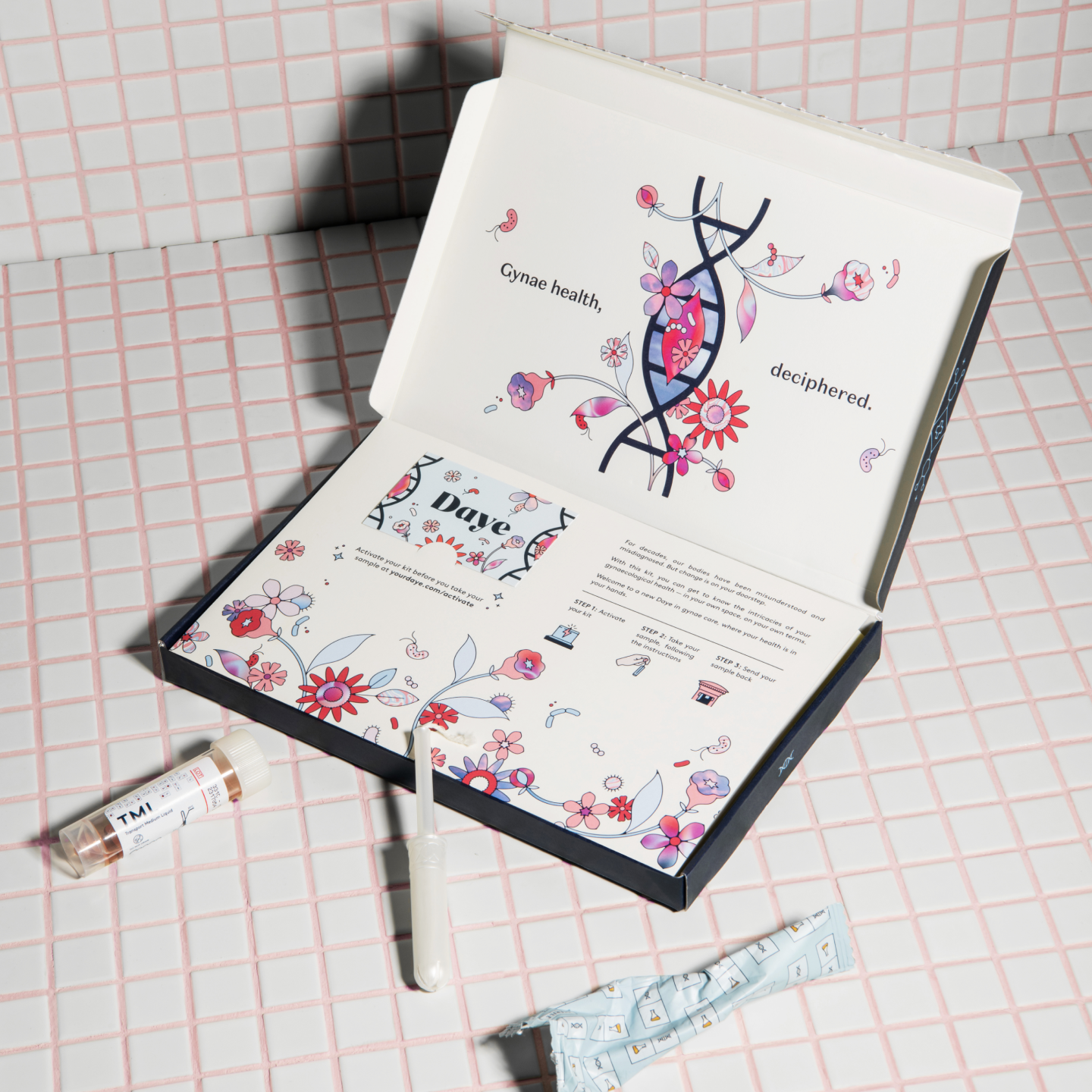 Gynae health kit from Daye. The kit is open, showing a tampon applicator, a wrapped tampon, and an instruction booklet with floral designs. The text reads 'Gynae health, deciphered.