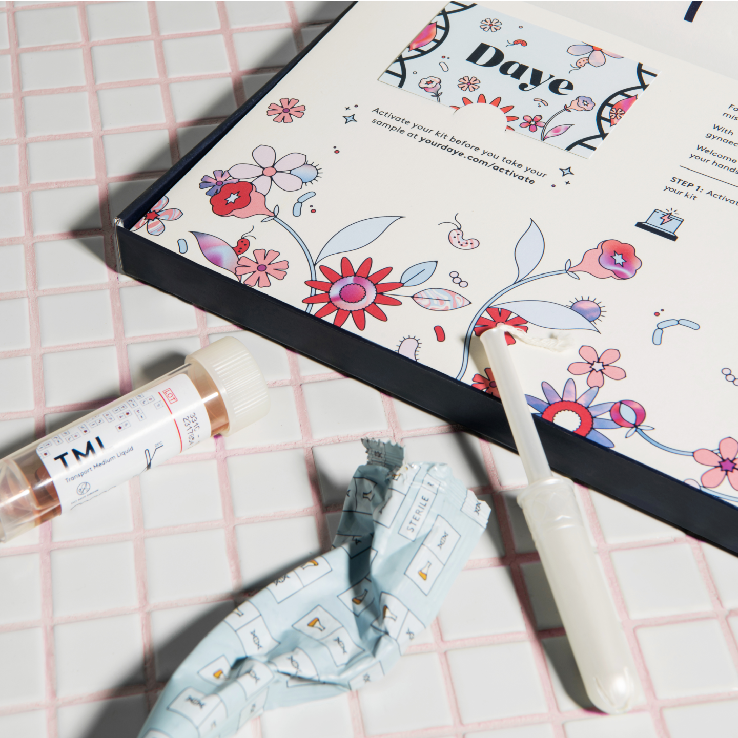 Box of Daye's at-home STI screen kit with an open tampon wrapper.