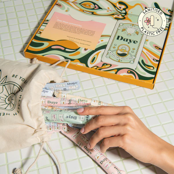 Hand grabbing a tampons from a pouch