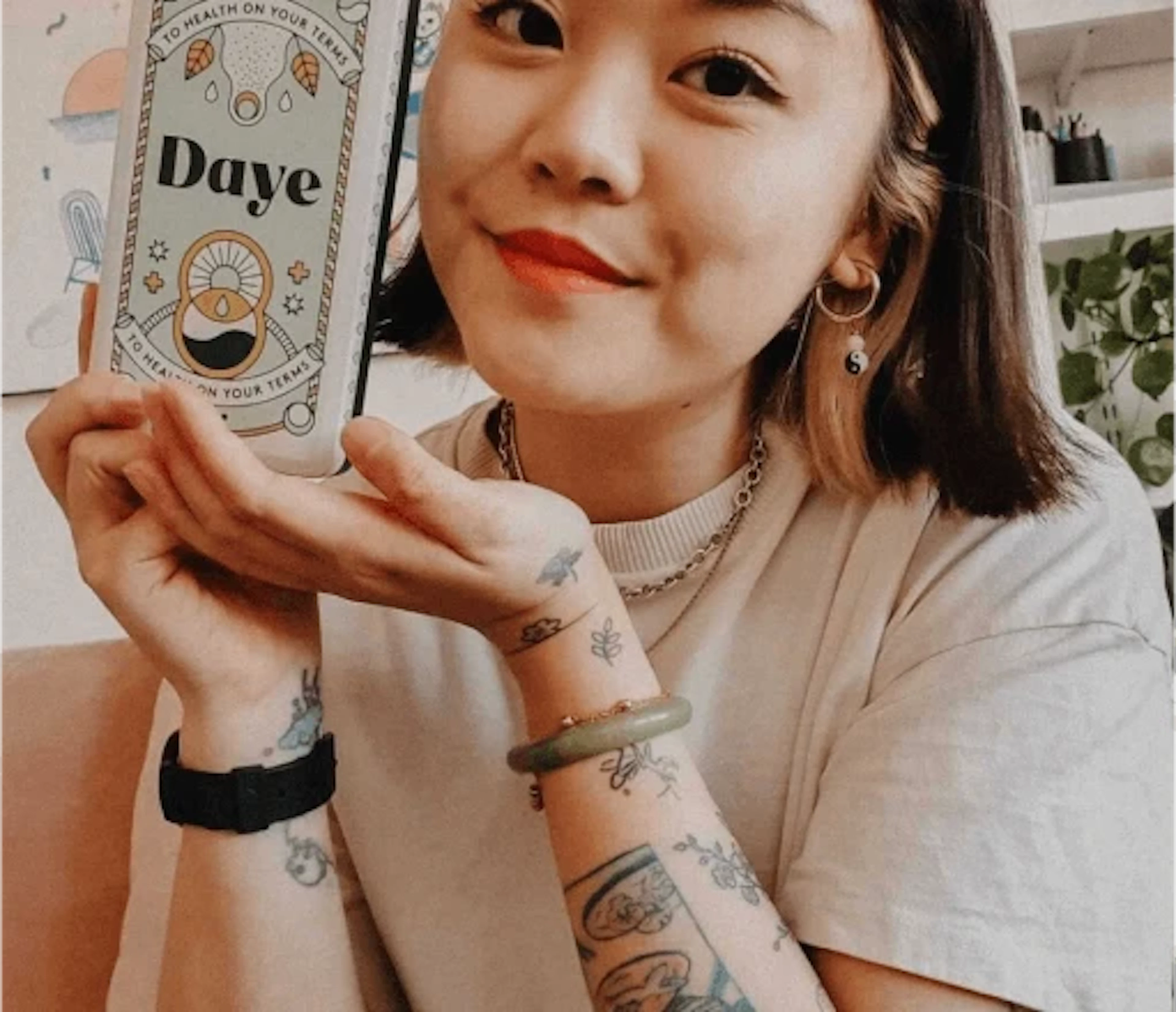 Woman holds recyclable aluminium tin filled with four organic, eco-friendly, sanitised tampons