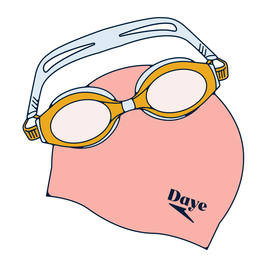 Swimming goggles next to a swimming hat.