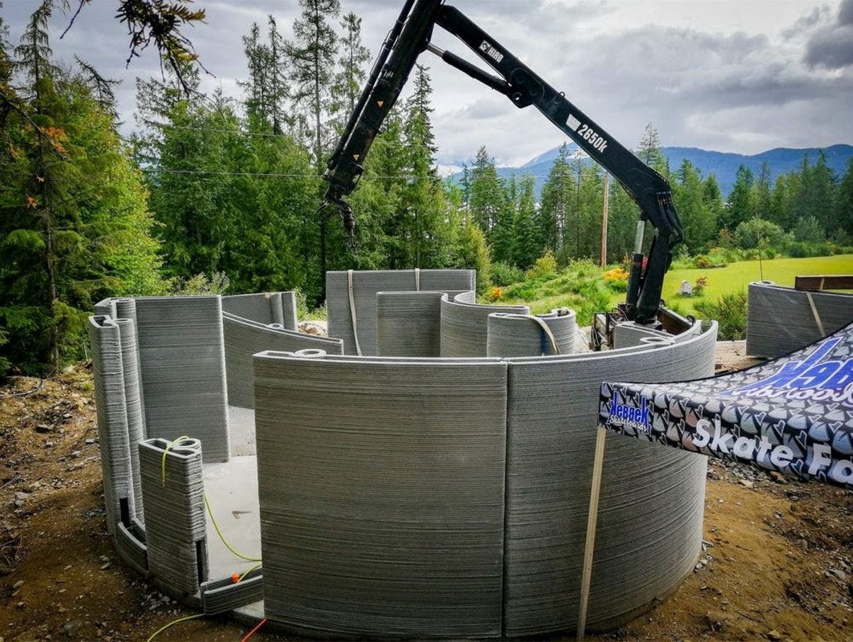 Machine 3D printing a home.