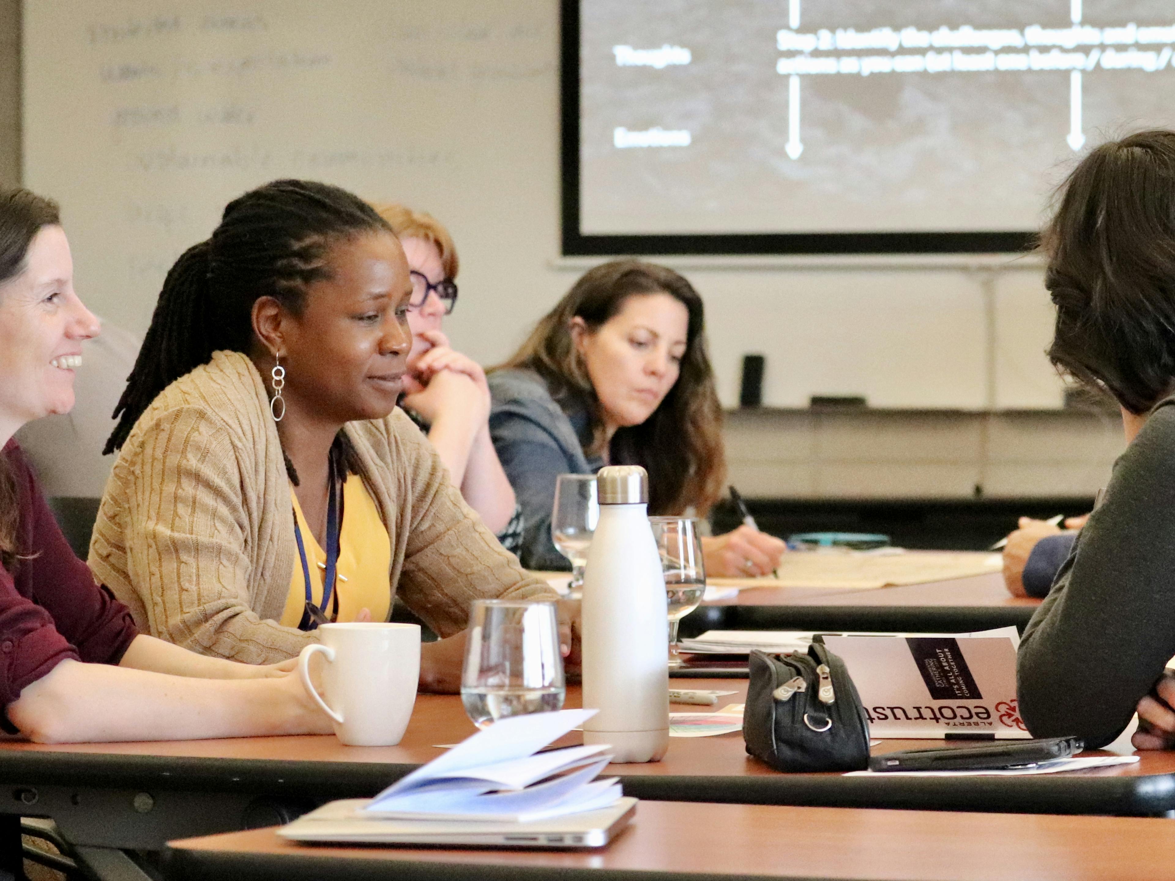 event attendees brainstorming at a table