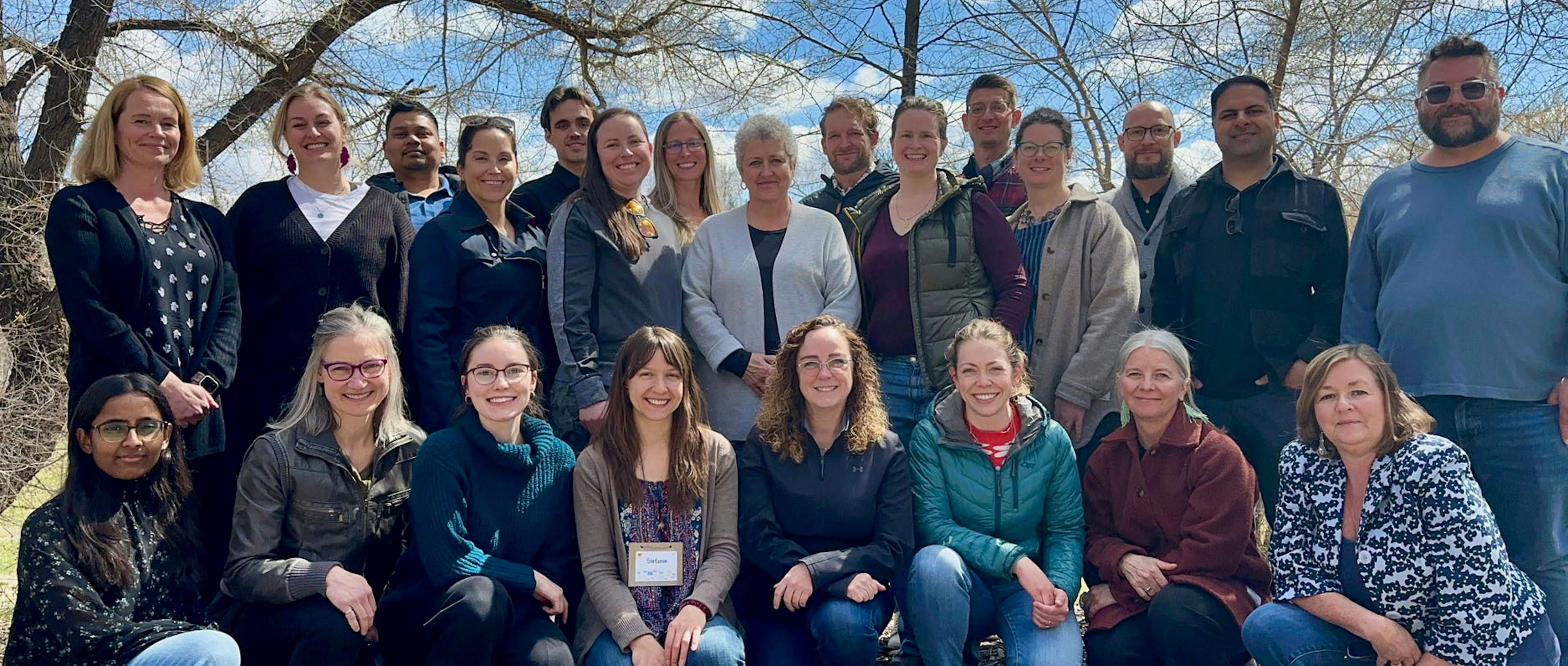 AEF retreat team photo 2024. People standing in group photo.