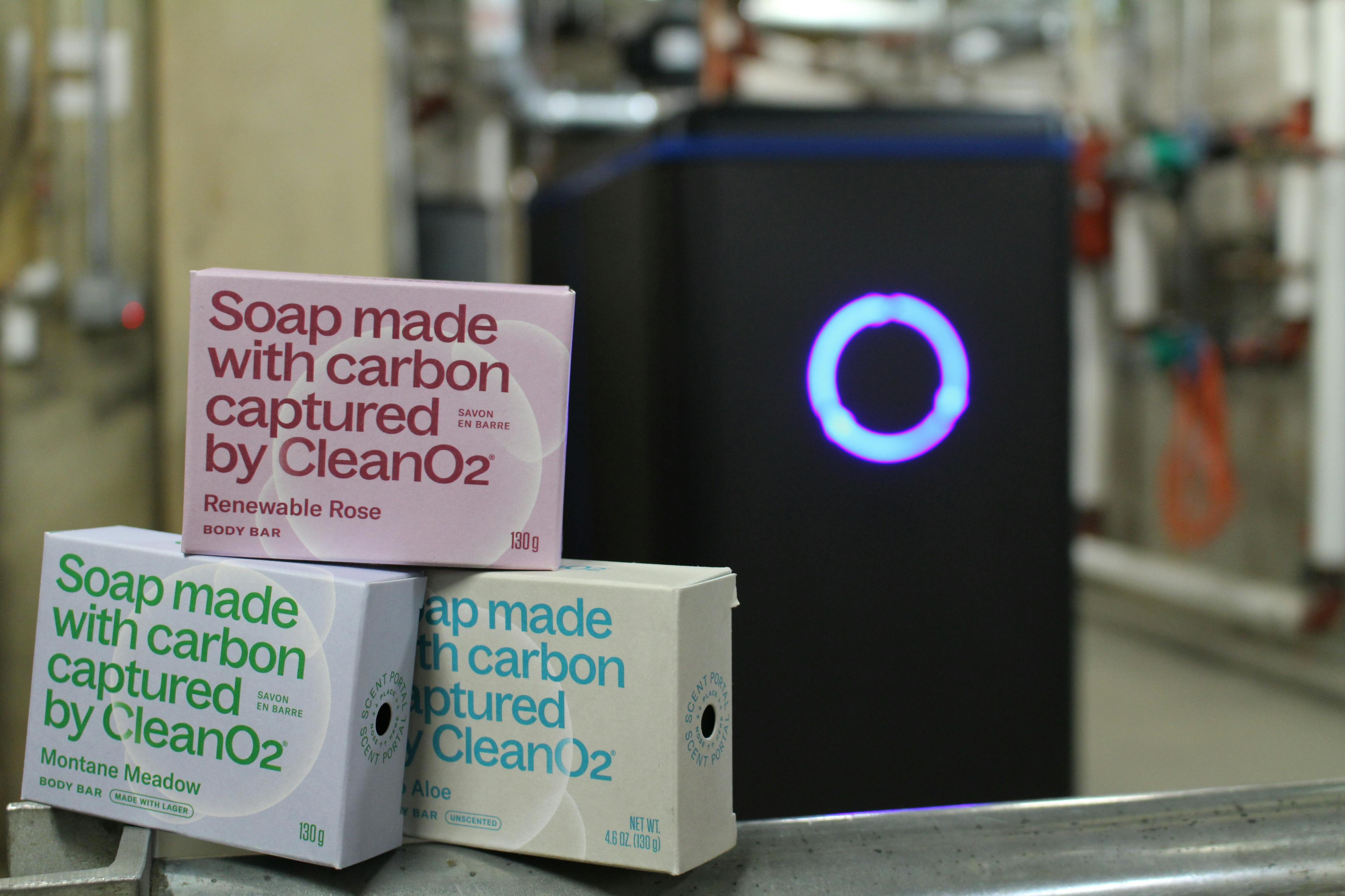 Three boxes of soap m ade with carbon captured by Carbon Capture Unit