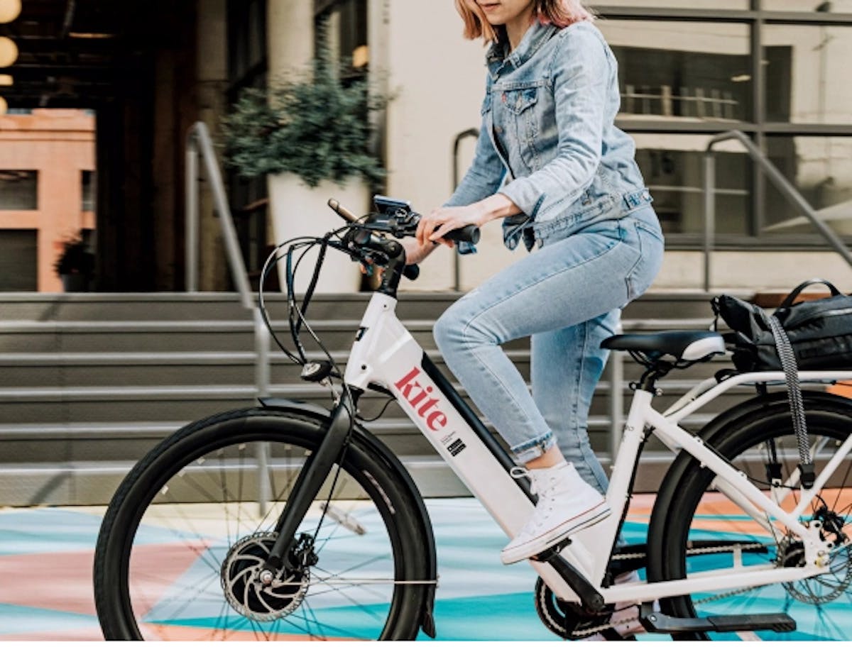 woman on electric bike branded Kite