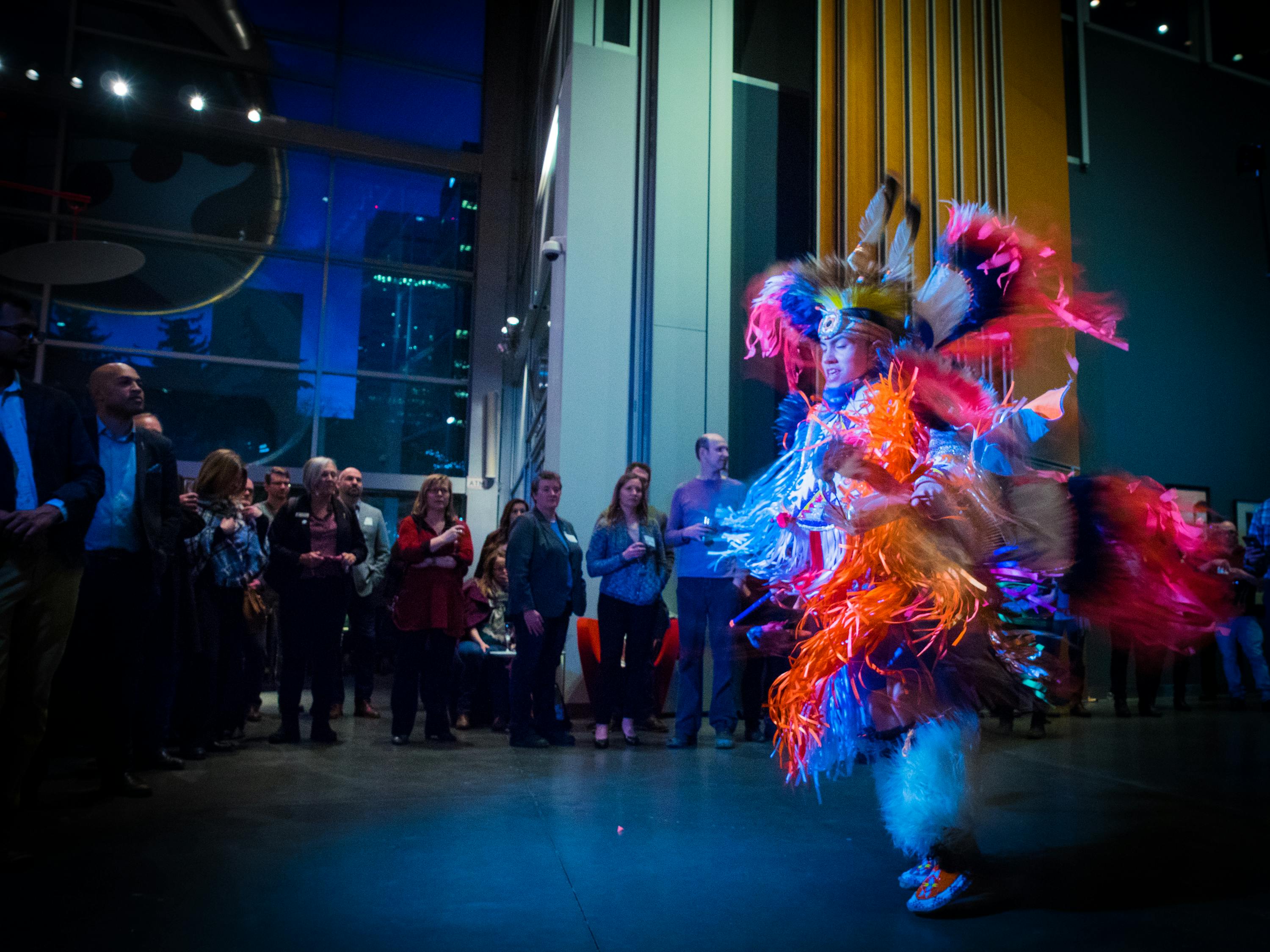 Indigenous dancer in front of a crowd