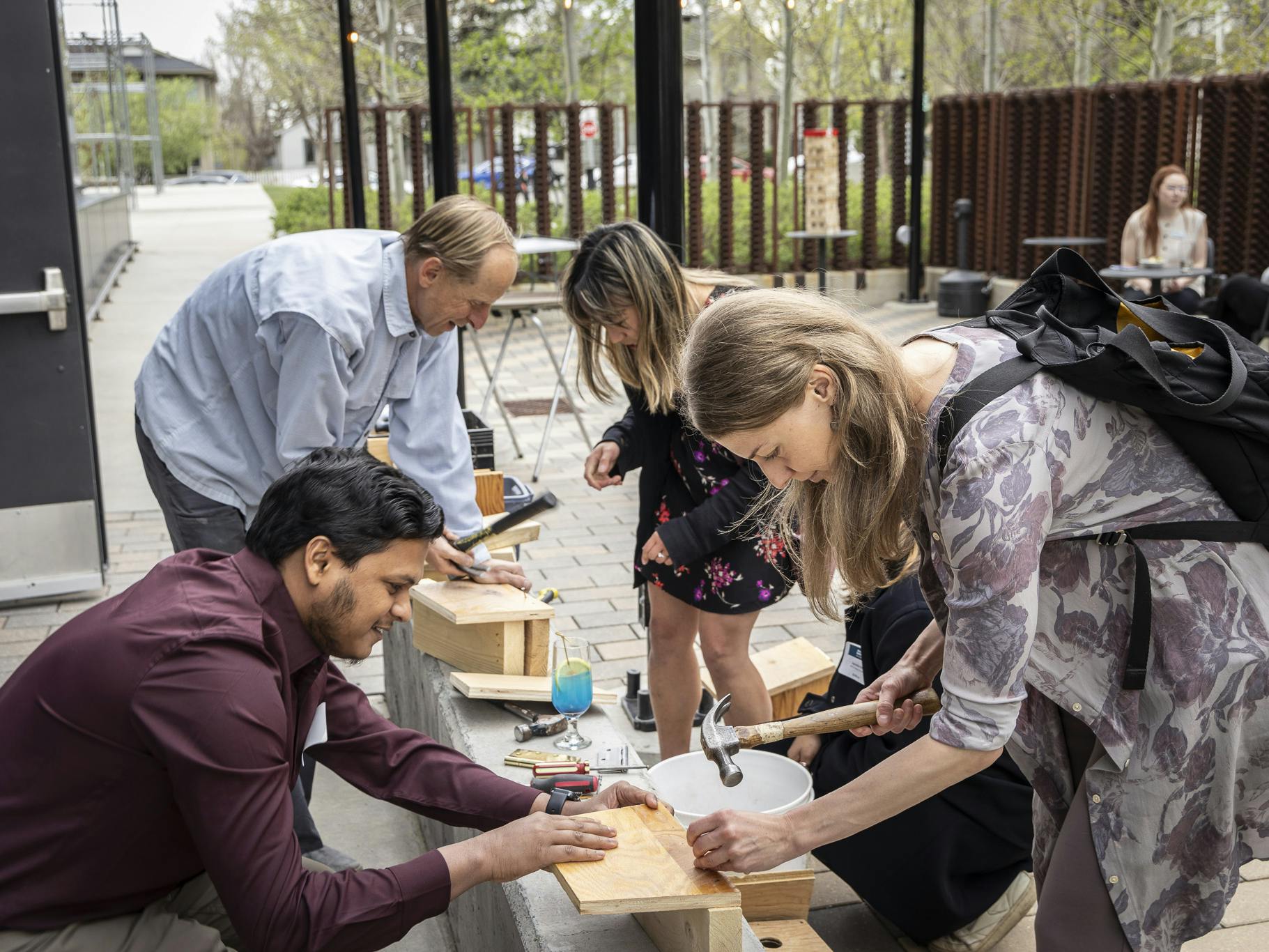 group of people working together on a craft