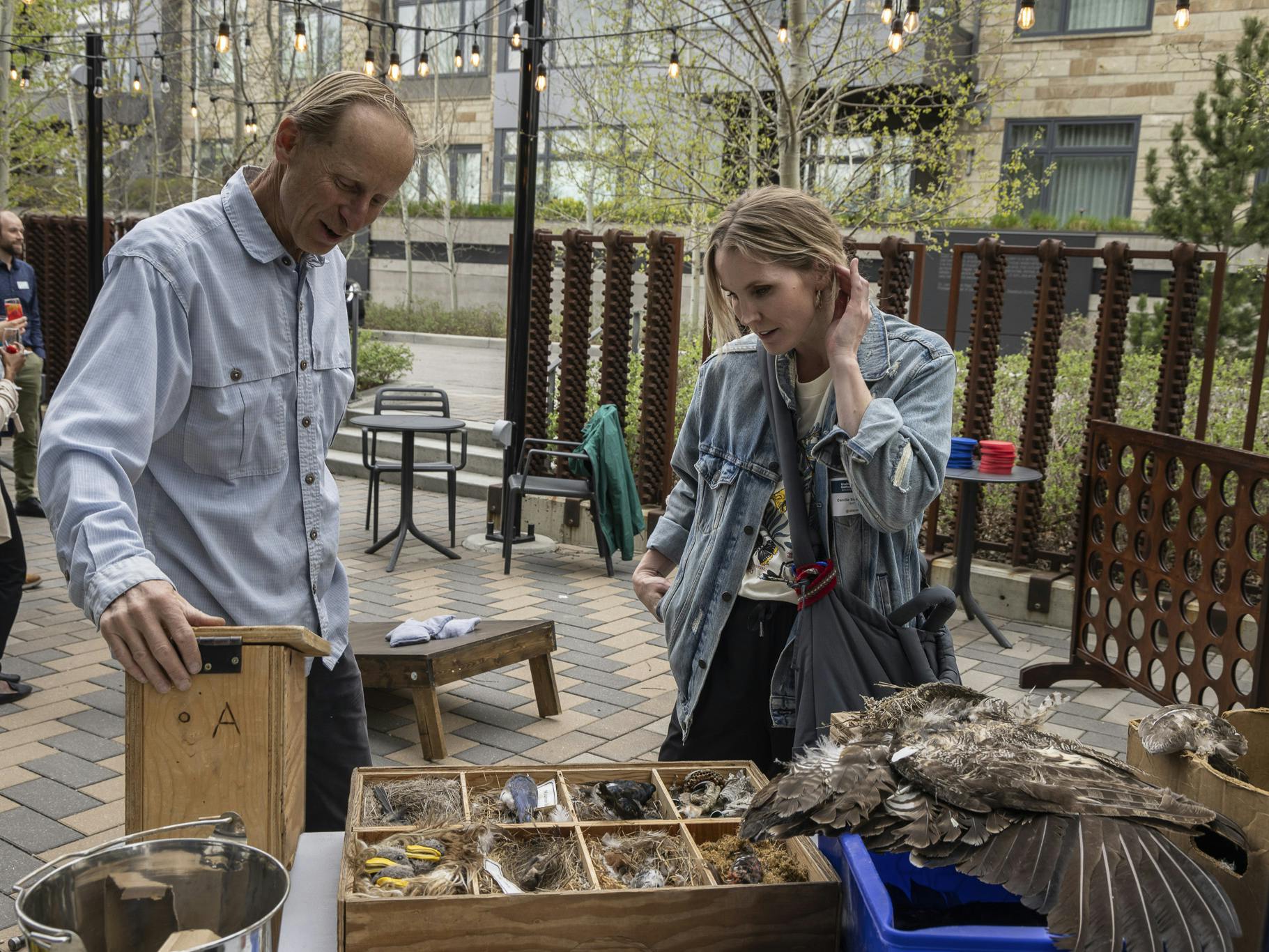 people talking around a craft table