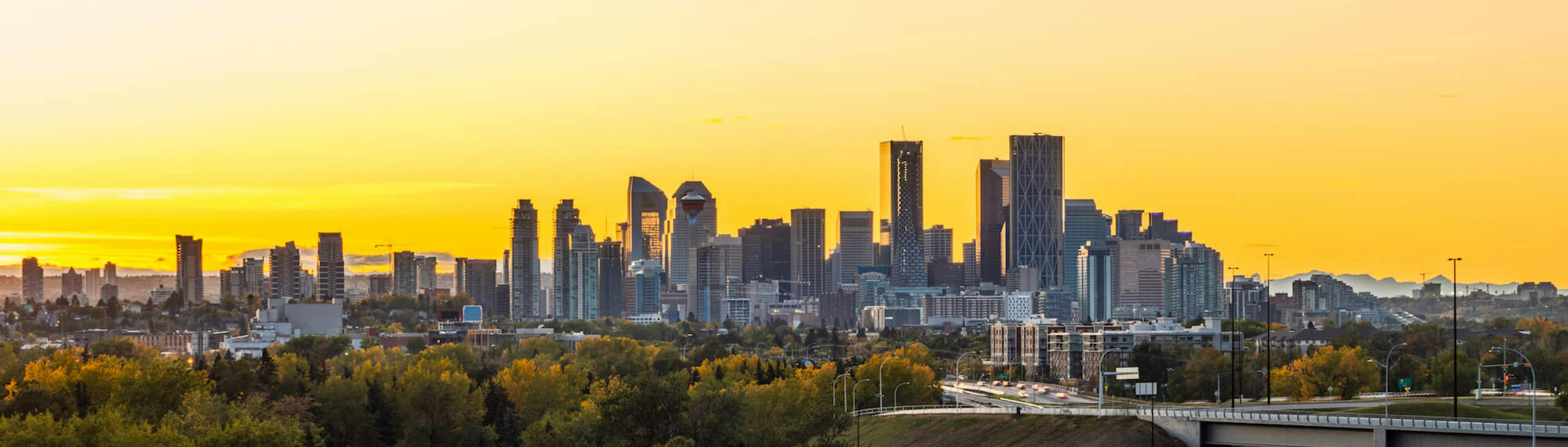 Calgary skyline against a yellow sky