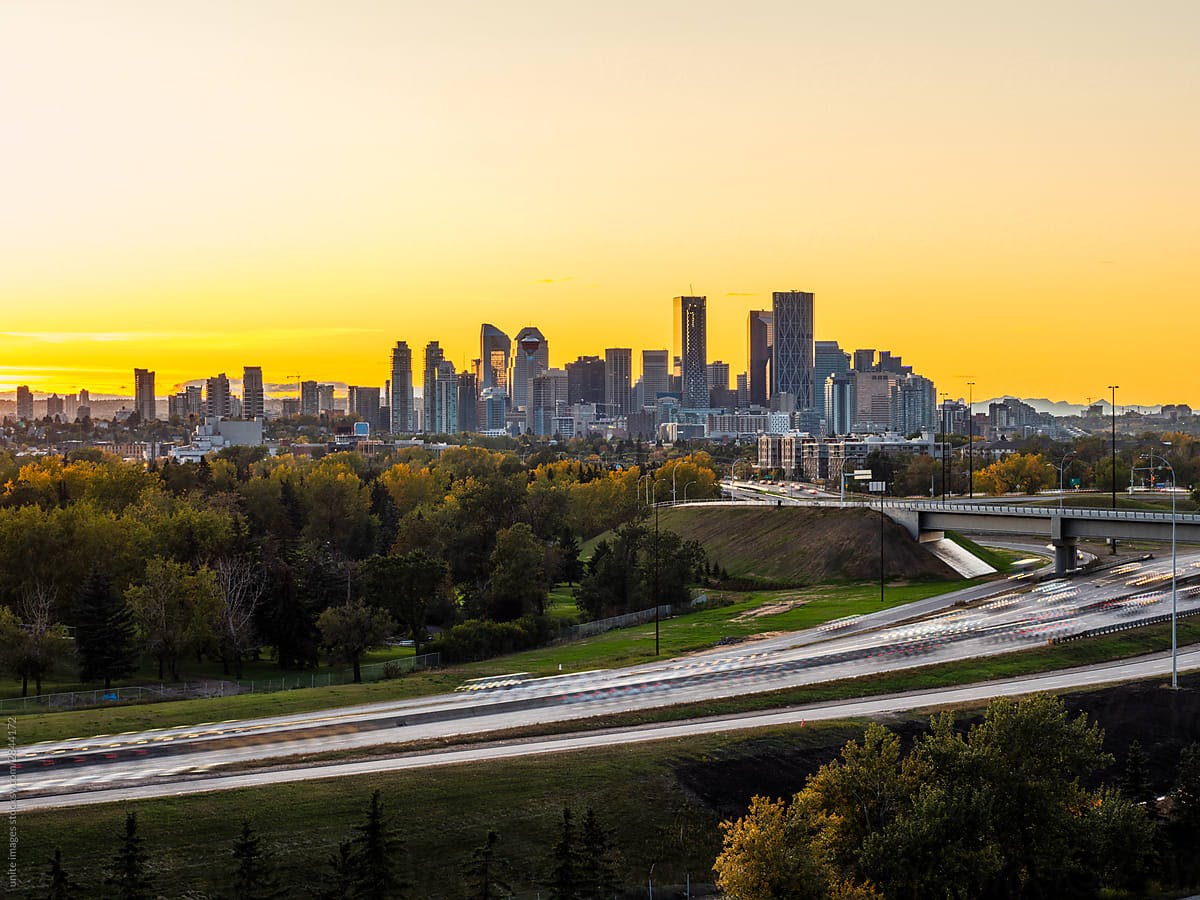 Calgary city skyline against a yellow sky