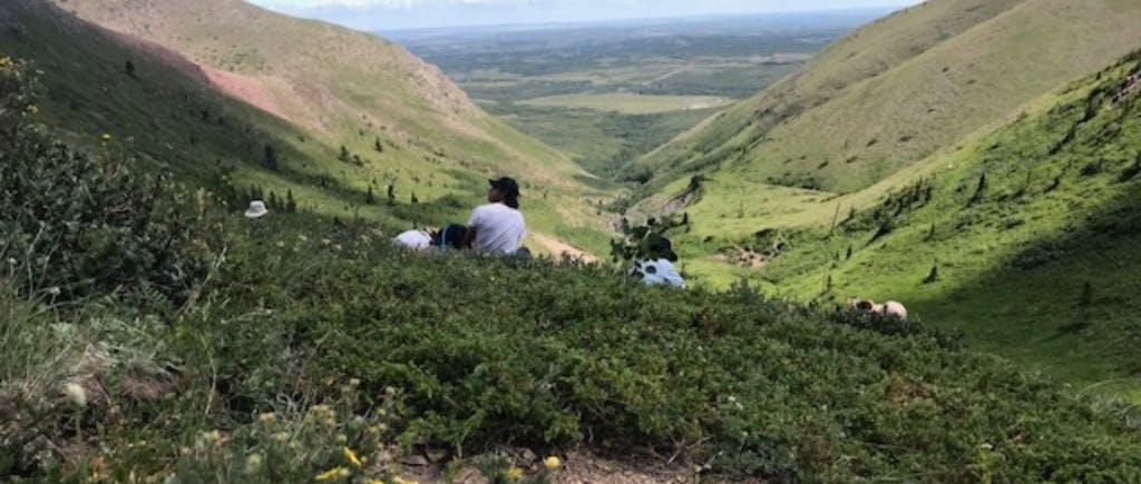 People sitting on a hillside