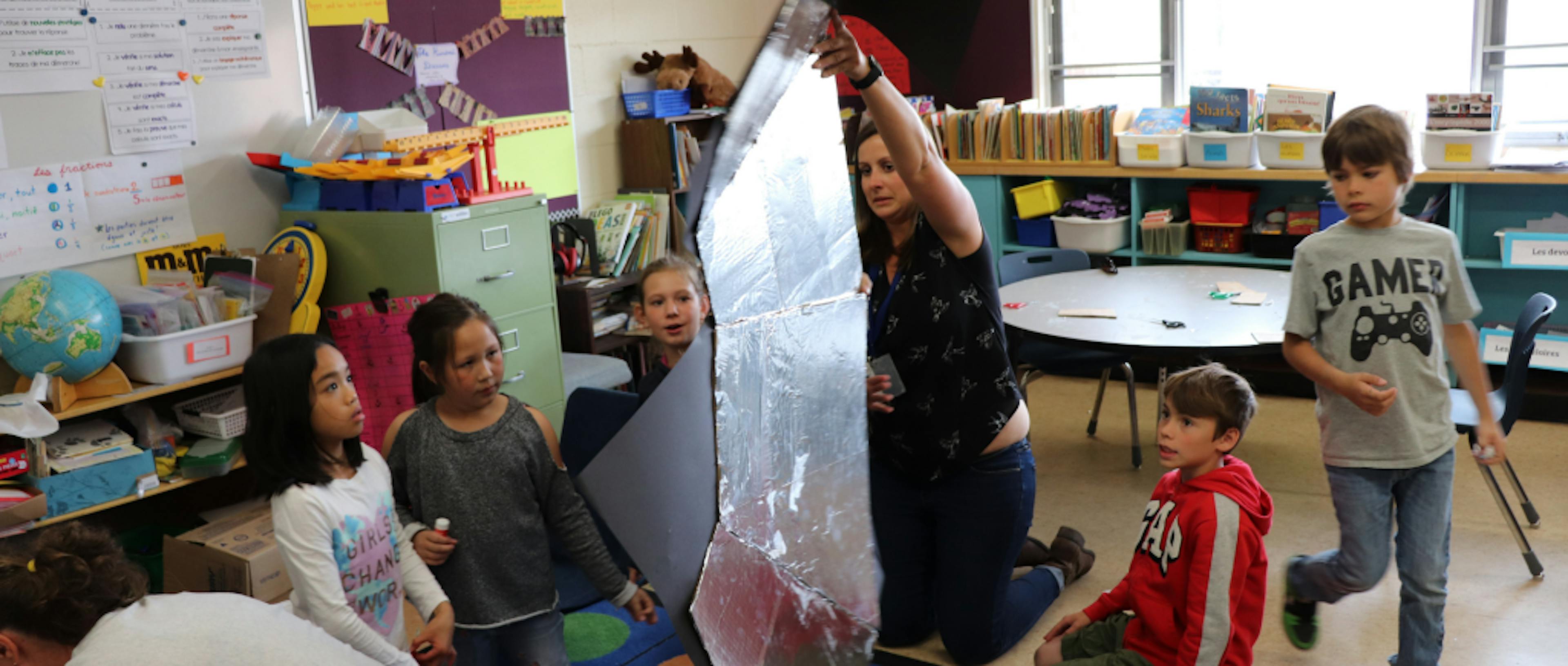 Children playing with a shiny object