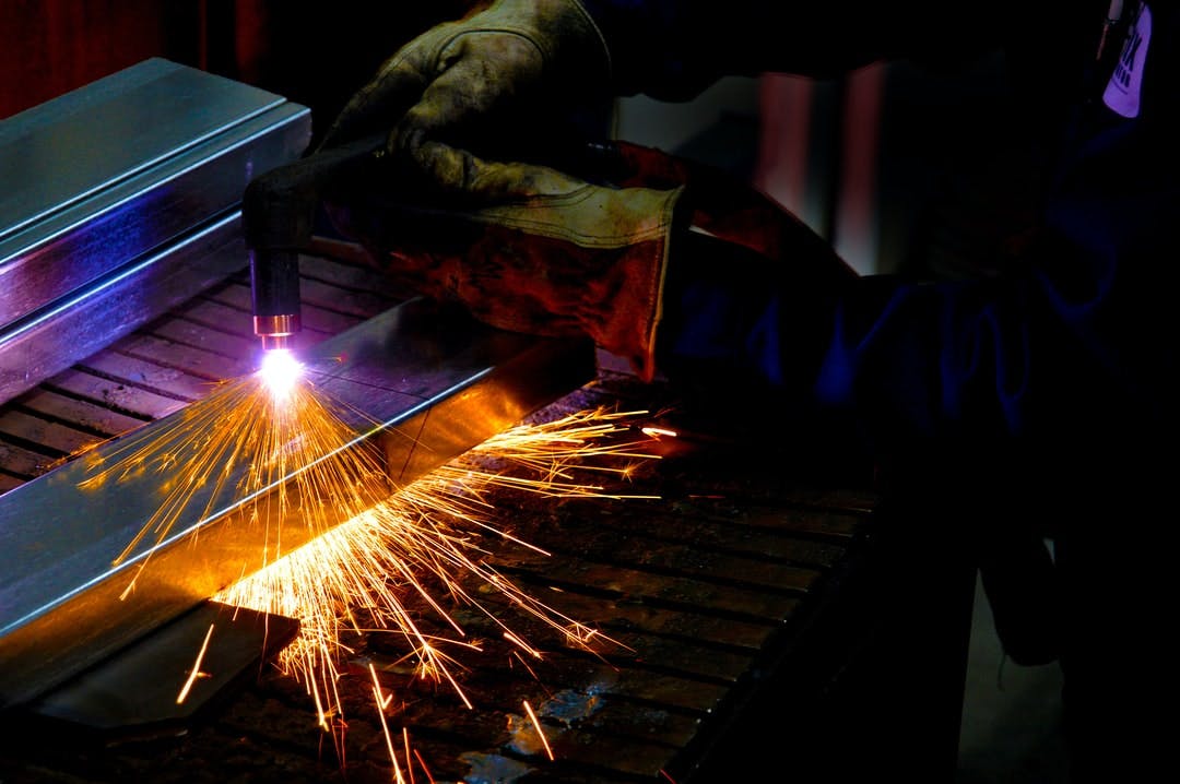 Plasma cutter in the hands of an expert High quality work at a factory