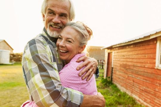 Rural Physicians Group - Hugging elderly couple
