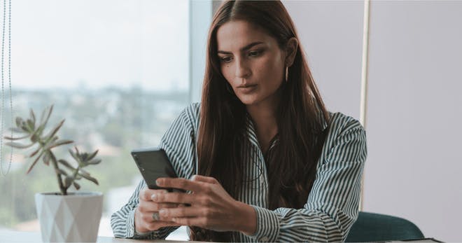 An employee learning on their mobile phone