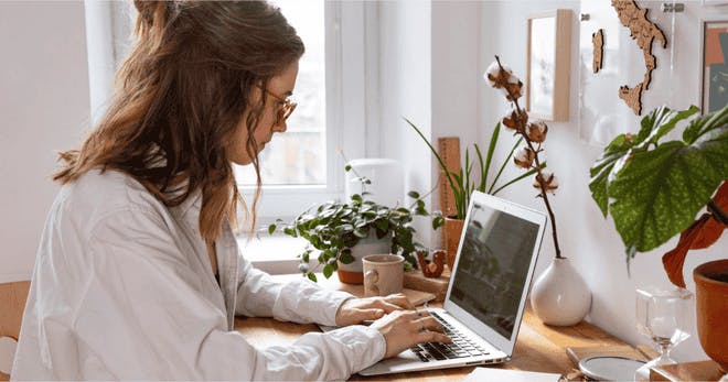 A worker studying on their laptop