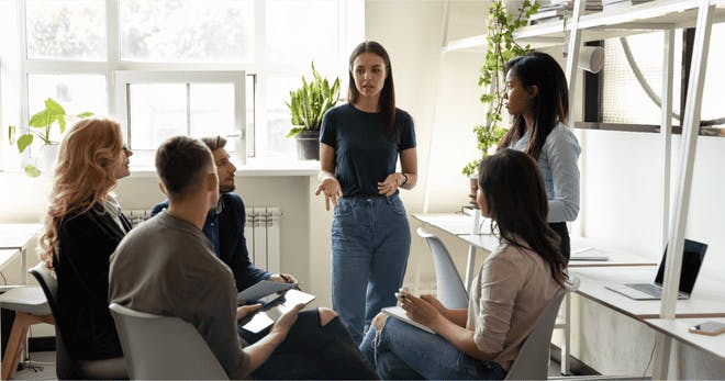 An employee teaching team members