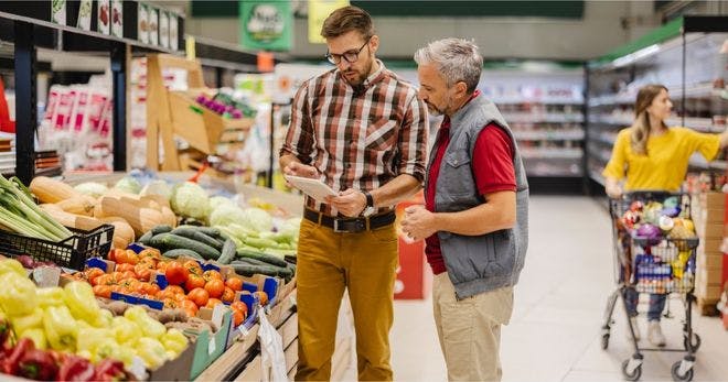 Retail manager talking to an employee