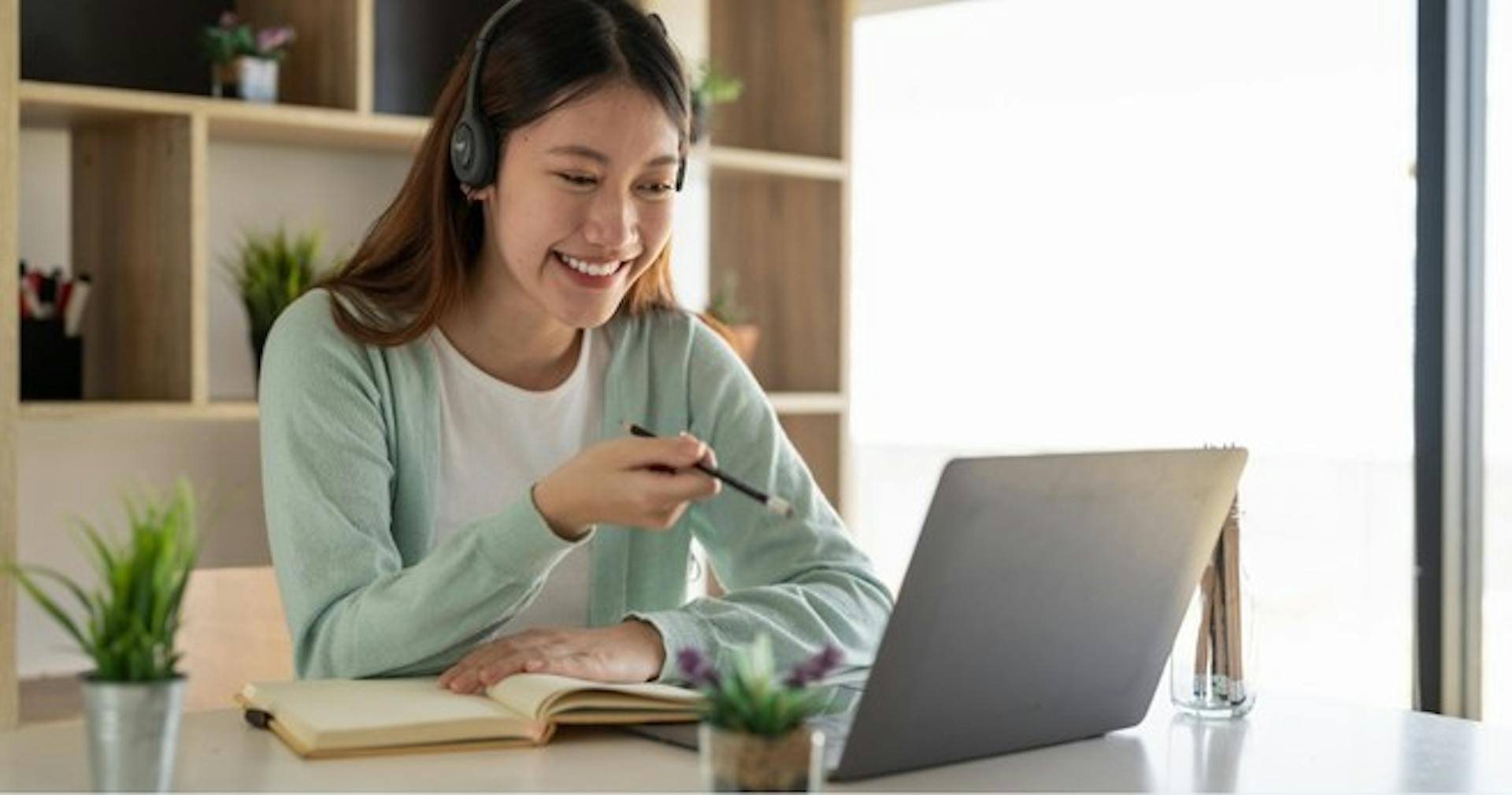 A woman engaged in distance learning by taking a class on her laptop