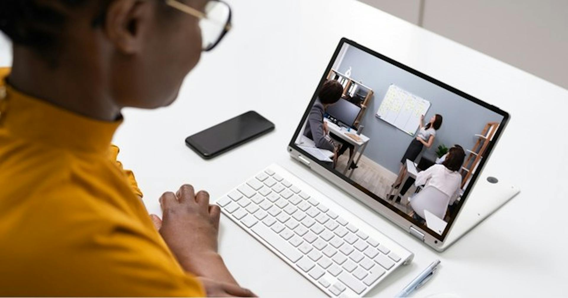 A person watching a video recording on their tablet